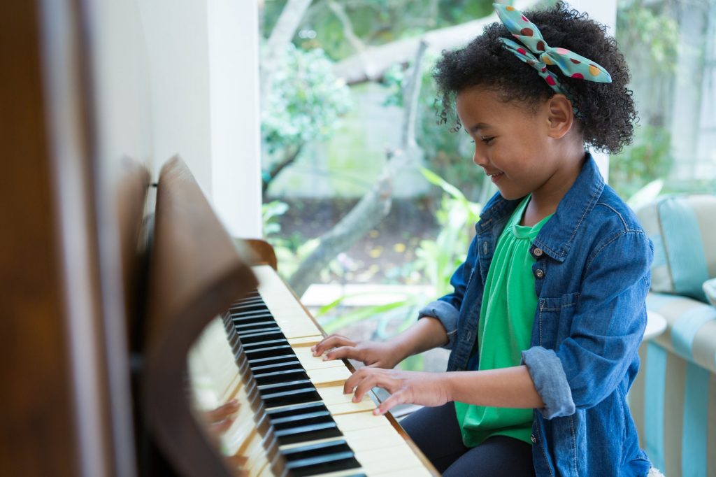 adorable-girl-playing-piano